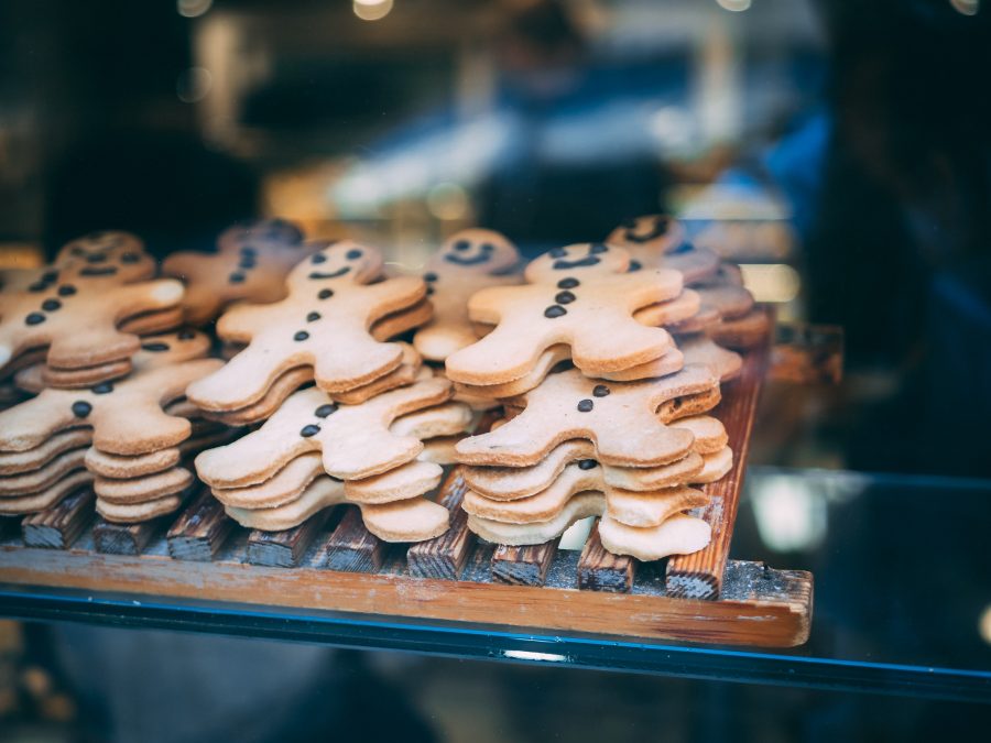 A stack of gingerbread cookies in a bakery window