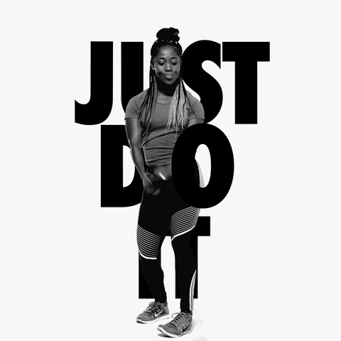A Black woman with braids is dancing with the words JUST DO IT enveloping her